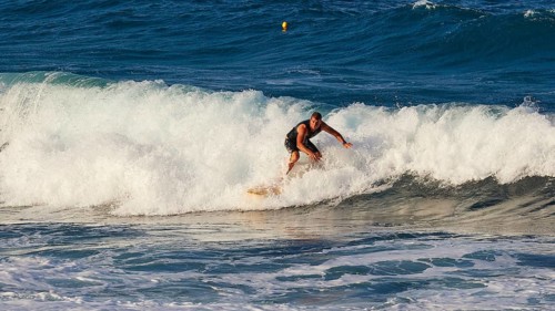 Surfer riding a wave in the sea with energy, wave surfer, surfer, surf, waves, west coast, Arkasa,