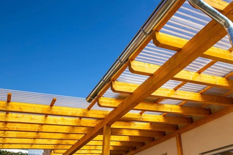 New patio roofing with wood and corrugated acrylic glass panels