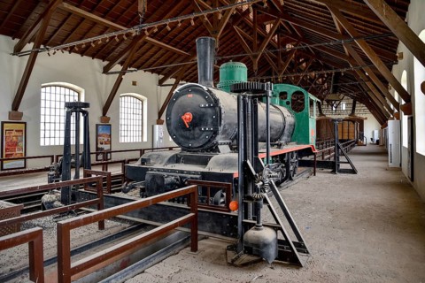 Historic locomotive of the Hejaz Railway in a renovated station building of Hegra, Mada'a in Salih,