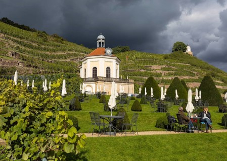Belvedere in Wackerbarth Castle Park with vineyards and Jacobstein, in sunshine and rain cloud,