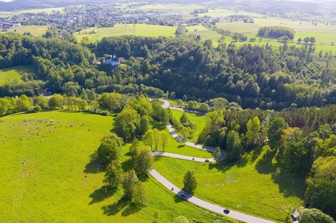 Aerial view of the winding serpentine road between Reifland and Rauenstein, in the background