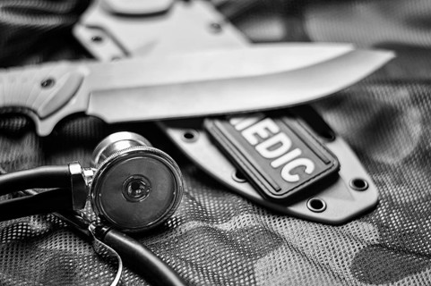 Stethoscope lies on the uniform of a US soldier. The concept of health care, military insurance,