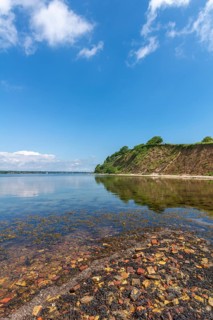 Steep coast with beach in the nature reserve Holnis peninsula on the Flensburg Fjord, NSG, bricks