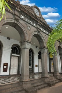 Former main entrance to historic post office above historic lettering Post Office, issuing office