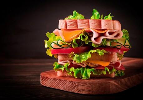 Club sandwich, on a wooden table, rustic style, close-up, no people, homemade