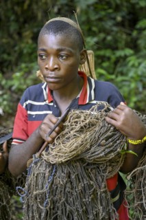Pygmy woman of the Baka or BaAka people with her hunting net, Dzanga-Sangha Special Dense Forest