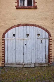 Historic buildings, facade, gate, wooden gate, heart-shaped cut-outs, Mesenich, district of