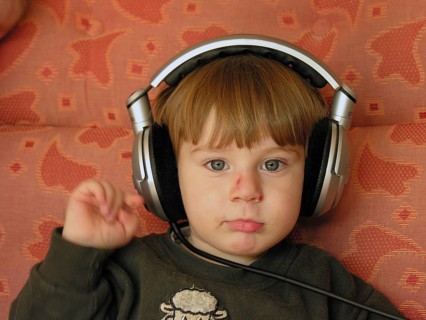 Portrait of a little boy, 3 years old with headphones, Franconia, Bavaria, Germany