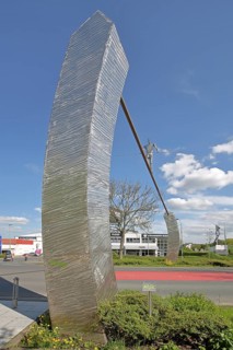 Sculpture Walking Man by E. R. Nele 2001, modern art, tightrope walker with pole balancing on rope,