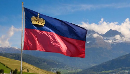 The flag of Liechtenstein flutters in the wind