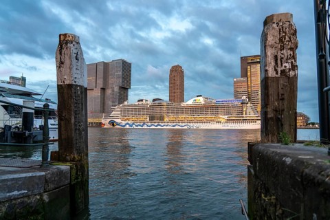 Rotterdam, skyline at the Nieuwe Maas, skyscrapers at the Kop van Zuid district, cruise ship Aida