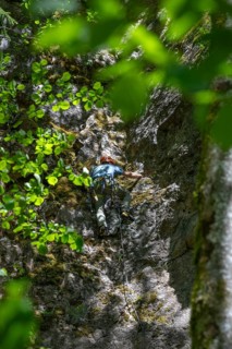 Climber on a rock face in Franconian Switzerland, Upper Franconia, Bavaria, Germany