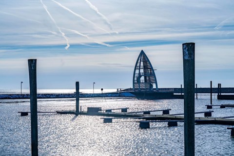 The East Frisian North Sea island of Juist in winter, empty sports harbour, lookout tower