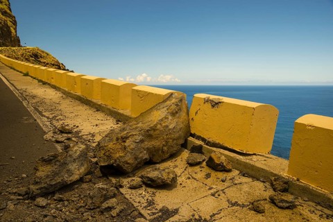 Rockfall, damaged concrete wall, road to Punta de Teno, Tenerife, Canary Islands, Spain