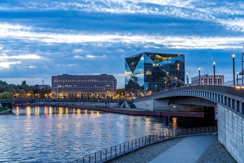 The modern Cube Berlin office building and the River Spree at dusk, Berlin, Germany