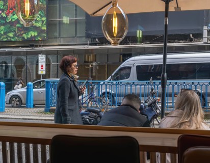 View through the window of a café of passers-by on Friedrichstraße in Mitte, Berlin, Germany