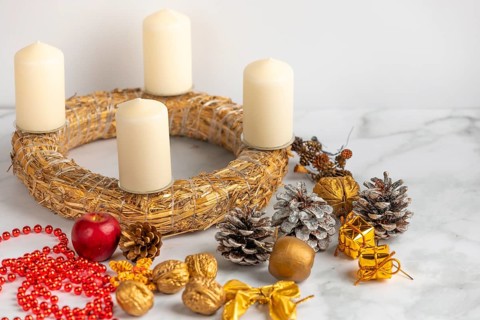 Making an Advent wreath, white candles, Christmas decorations, white background