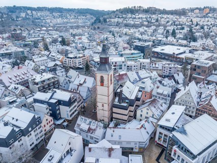 City panorama with snow and dominating church tower, snow-covered roofs, Nagold, Black Forest,