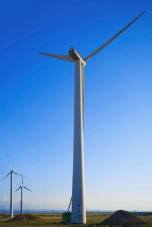 Majestic wind turbines against a clear blue sky in California, USA. The scene captures the essence