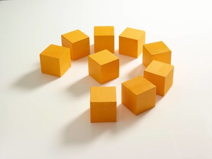 9 yellow wooden cubes against a white background