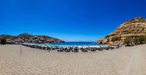 Matala beach with a view of the rock caves, south coast, Crete, Greece