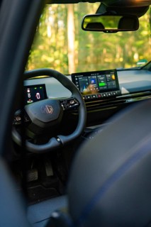 Modern interior of a black car with touchscreen in the forest, Deer E- Carsharing, Calw, Black