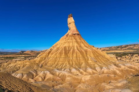 Majestic castildetierra rock formation rising from the arid landscape of bardenas reales natural
