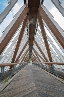 Modern wooden bridge with glass and symmetrical architecture