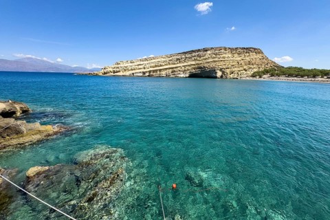 View of Matala Bay with Libyan Sea Mediterranean on south coast of Crete island, in the background