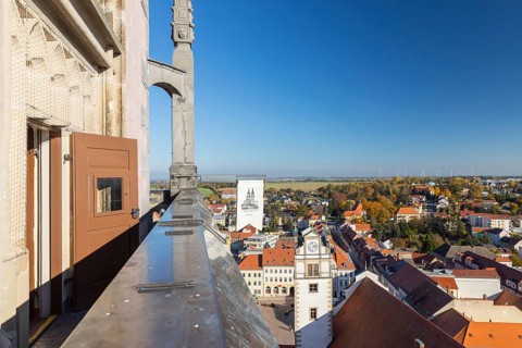 View of the town from the tower of St. Aegidien Church in autumn, with the town hall tower in the