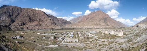 Panorama, Abandoned ruined buildings in mountain landscape, Ghost town, Engilchek, Tian Shan,