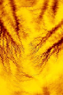 A captivating abstract image featuring vibrant yellow and brown tones with wavy, distorted patterns