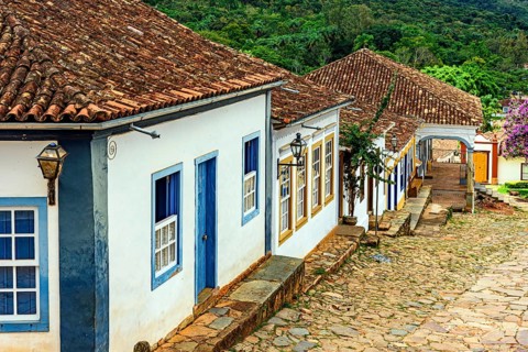 Old colonial-style houses on a slope with cobblestones in the city of Tiradentes in Minas Gerais,