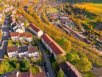Bird's eye view of a housing estate with residential buildings and green surroundings, Nagold,