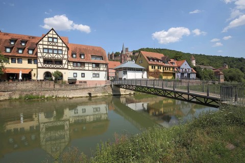 Pedestrian bridge over the Tauber and cityscape, half-timbered house, Ufer, Wertheim,