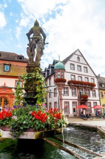 Marktplatz Brunnen water fountain in the medieval village Gengenbach in the Black Forest, Germany