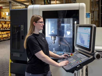 Oberhausen, North Rhine-Westphalia, Germany, Trainee woman in metalworking. Trainee cutting machine