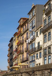 Colorful facades of houses along Cais da Estiva in the Ribeira district, Porto, Portugal