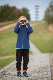 Young boy looking through the binoculars