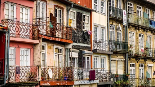 Beautifully decorated balconies on colorful, historic old town buildings, Porto, Portugal