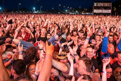 JAROCIN, POLAND - JULY 18, 2025: Jarocin Festival 2025 with rock music. Crowd surfing woman on the