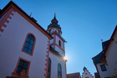 Historic church in sunshine with picturesque towers against clear blue sky, Protestant City Church,