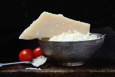 Parmesan cheese, grated cheese in rind and piece of Parmesan, Italy