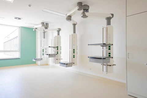 Operating room with modern ceiling systems and neutral colors, functional and open, stroke ward,