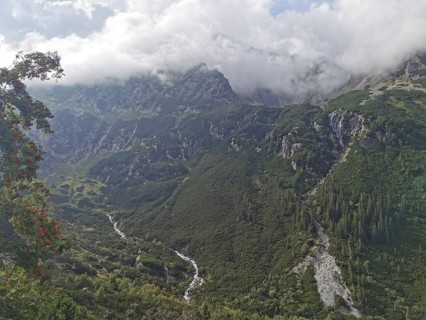 Dramatic valleys and hills with clouds covering the peaks, Zakopane, hiking in the High Tatras