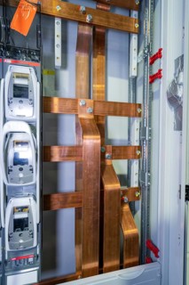 Detailed view of copper rods in an industrial cable cabinet, switch cabinet construction, PV plant