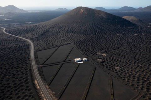 Aerial perspective highlighting the unique landscape of La Geria, Lanzarote with traditional