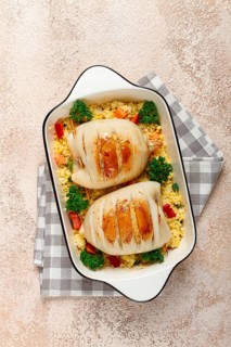 Stuffed squid carcasses, baked in the oven, fried, with couscous, top view, homemade, no people