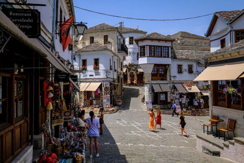 City of Gjirokastra, Gjirokastra, Albania, Tourists visit the historic centre of the mountain city