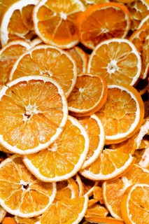 A close up view of dried orange slices showcasing their vibrant color and textured surface, ideal
